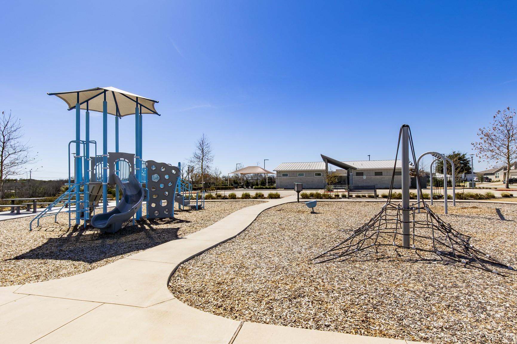 8304 Mimi Lane Austin, TX 78724 - Photo 32 of 32 a view of a swimming pool with a table and chairs