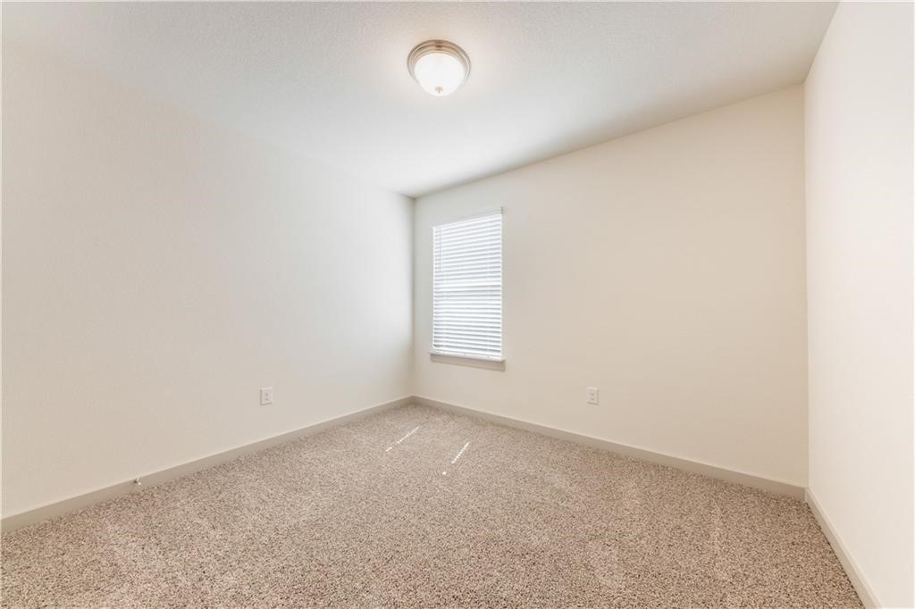 8304 Mimi Lane Austin, TX 78724 - Photo 8 of 32 an empty room with a window