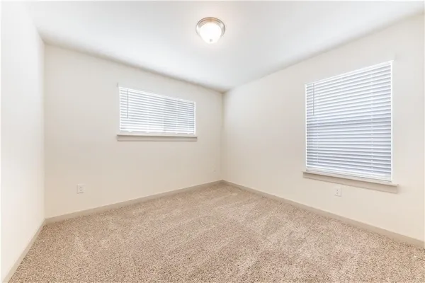 an empty room with a empty space and a window