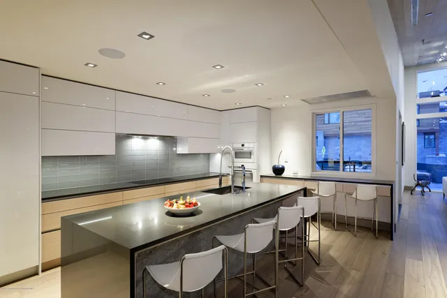 a kitchen with stainless steel appliances granite countertop a sink and cabinets
