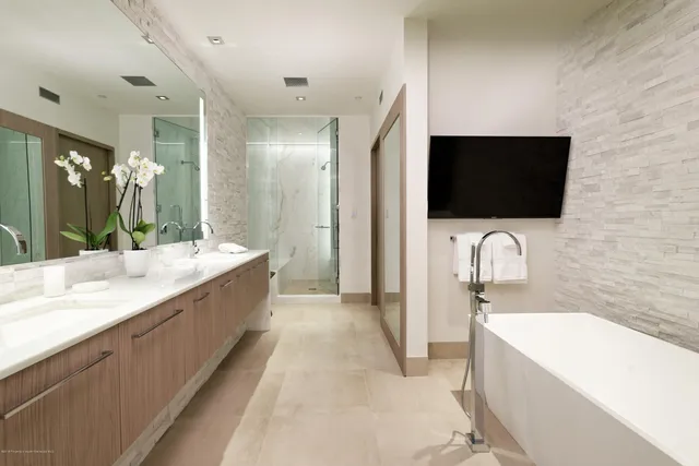 a bathroom with a shower and a toilet