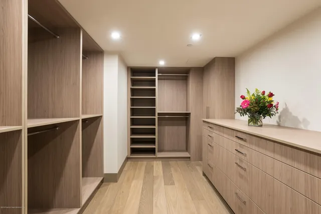 a bedroom with a bed and a flat screen television