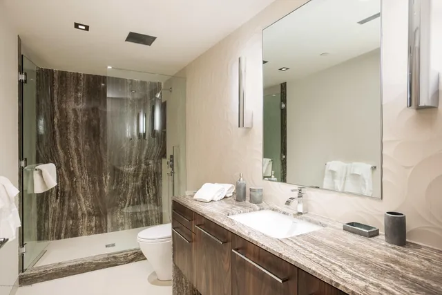 a bathroom with a bathtub and a shower