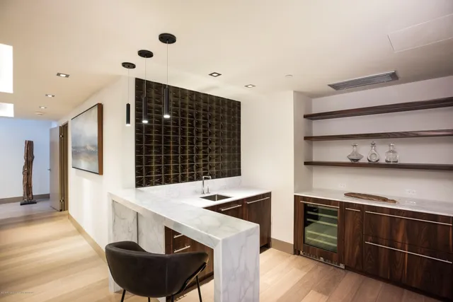 a living room with fireplace furniture and a flat screen tv