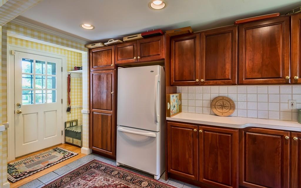 3 Rainbow Road Marblehead, MA 01945 - Photo 13 of 28 a white refrigerator freezer sitting inside of a kitchen