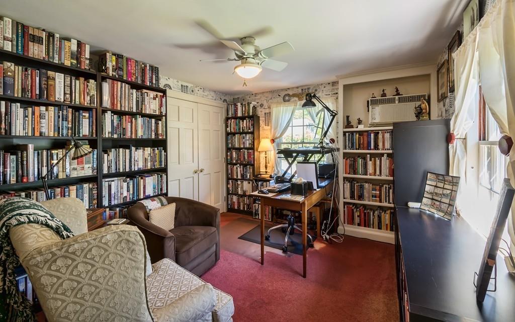 3 Rainbow Road Marblehead, MA 01945 - Photo 16 of 28 a living room with furniture and a book shelf