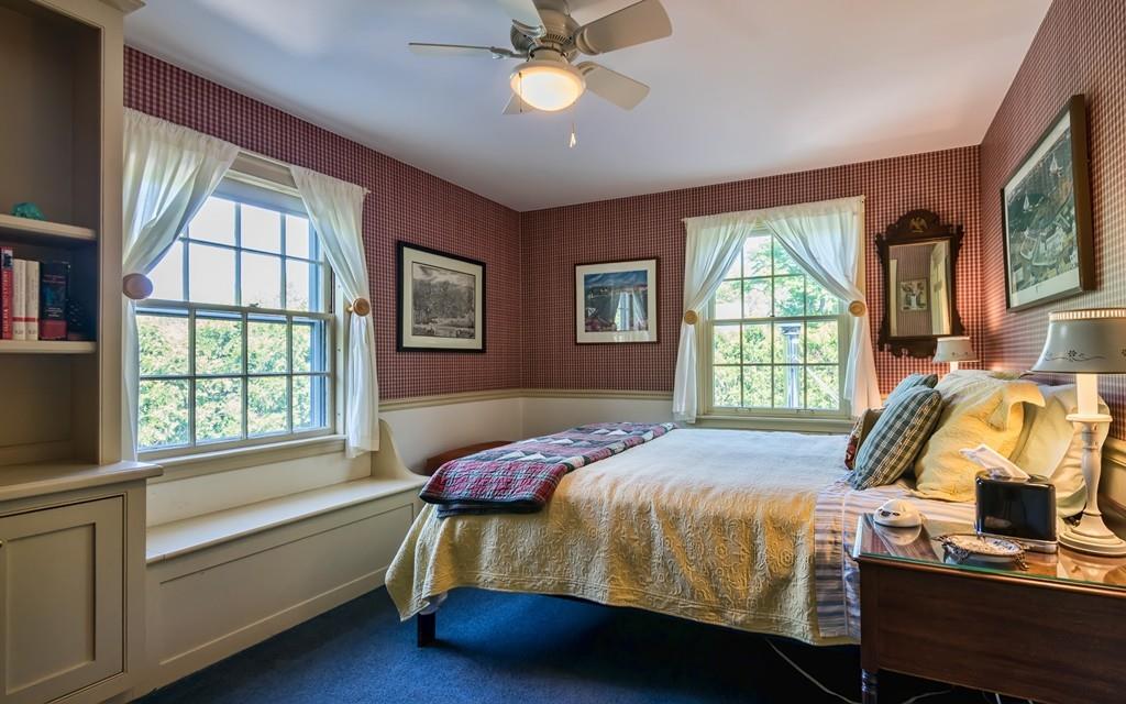 3 Rainbow Road Marblehead, MA 01945 - Photo 17 of 28 a bed sitting in a bedroom next to a window