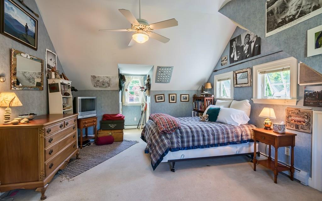 3 Rainbow Road Marblehead, MA 01945 - Photo 20 of 28 a bed room with furniture and a chandelier