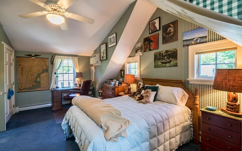 3 Rainbow Road Marblehead, MA 01945 - Photo 24 of 28 a bedroom with a large bed and a chandelier
