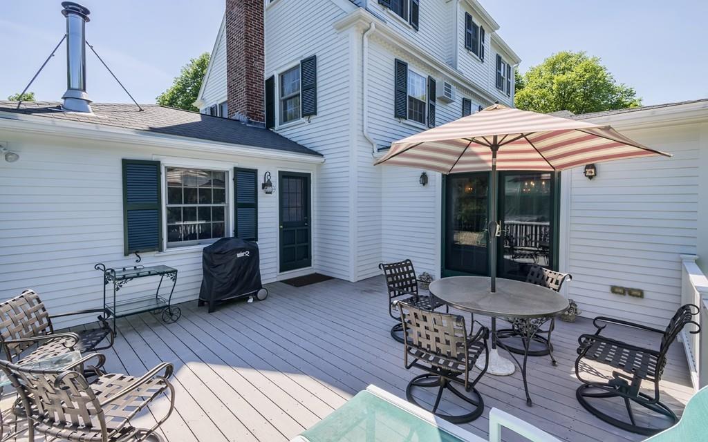 3 Rainbow Road Marblehead, MA 01945 - Photo 27 of 28 a view of a patio with table and chairs and wooden floor