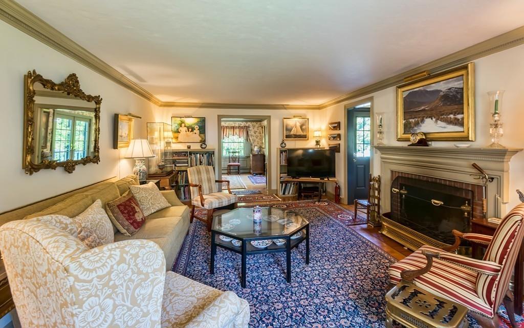 3 Rainbow Road Marblehead, MA 01945 - Photo 3 of 28 a living room with furniture a flat screen tv and a fireplace
