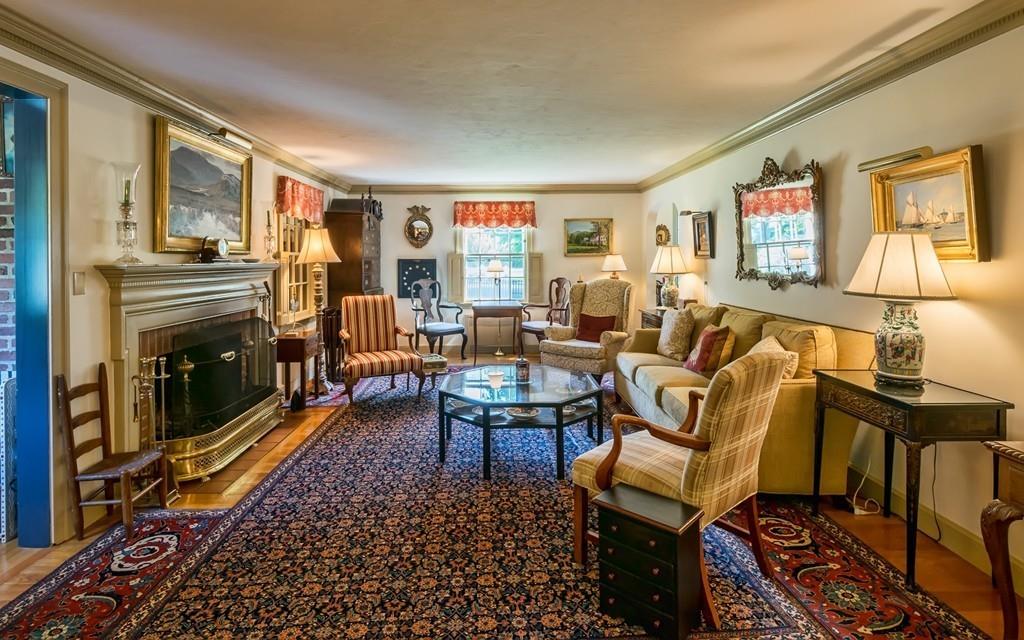 3 Rainbow Road Marblehead, MA 01945 - Photo 4 of 28 a living room with furniture a rug and a fireplace