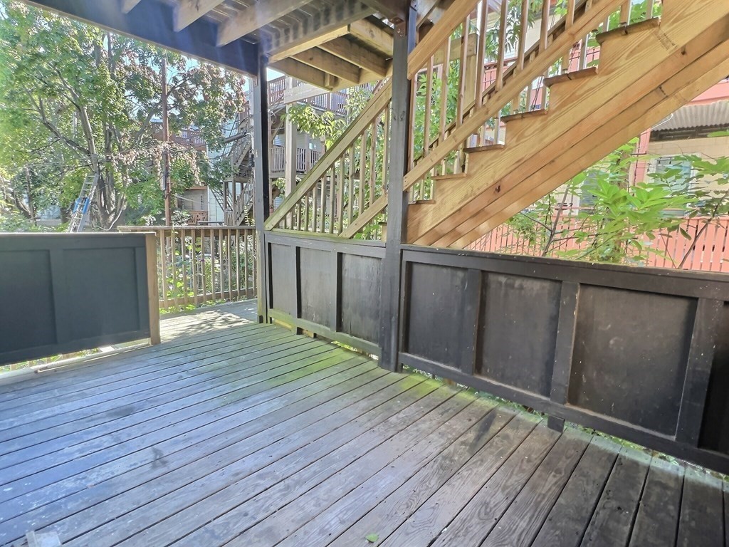 255 Paris Street, Unit 1 Boston, MA 02128 - Photo 15 of 15 a balcony with wooden floor