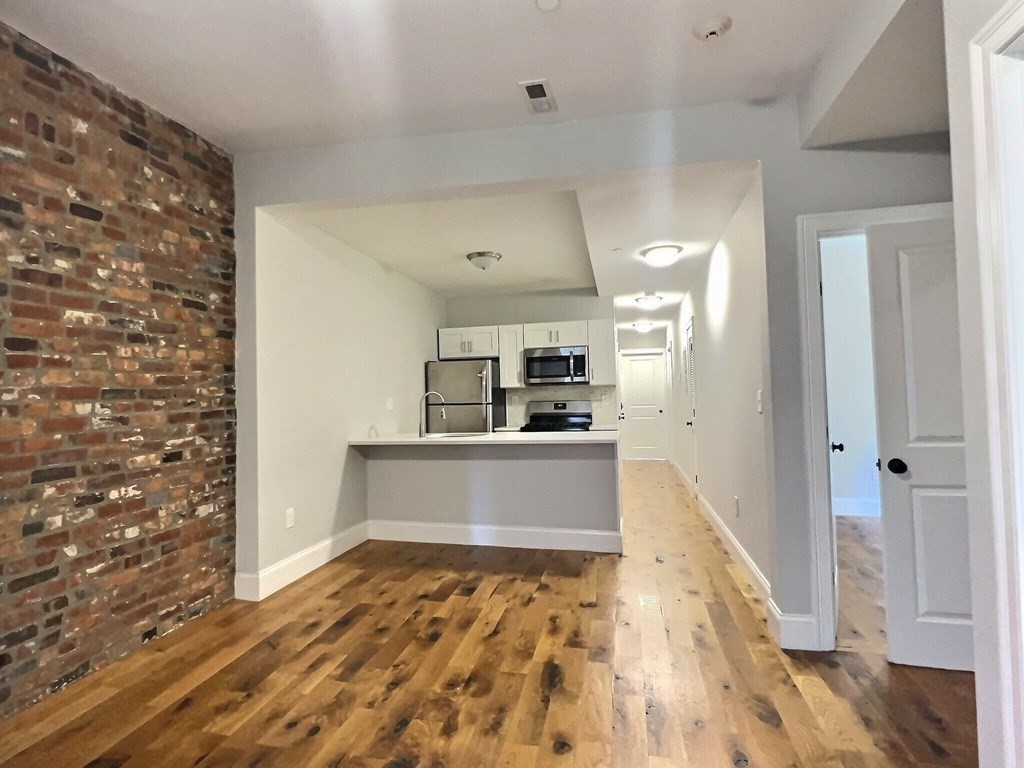 255 Paris Street, Unit 1 Boston, MA 02128 - Photo 3 of 15 a view of kitchen and utility room