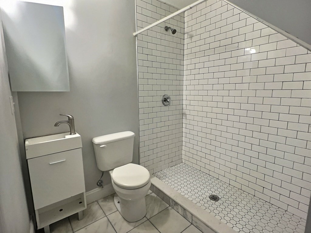 255 Paris Street, Unit 1 Boston, MA 02128 - Photo 8 of 15 a bathroom with a toilet and a shower