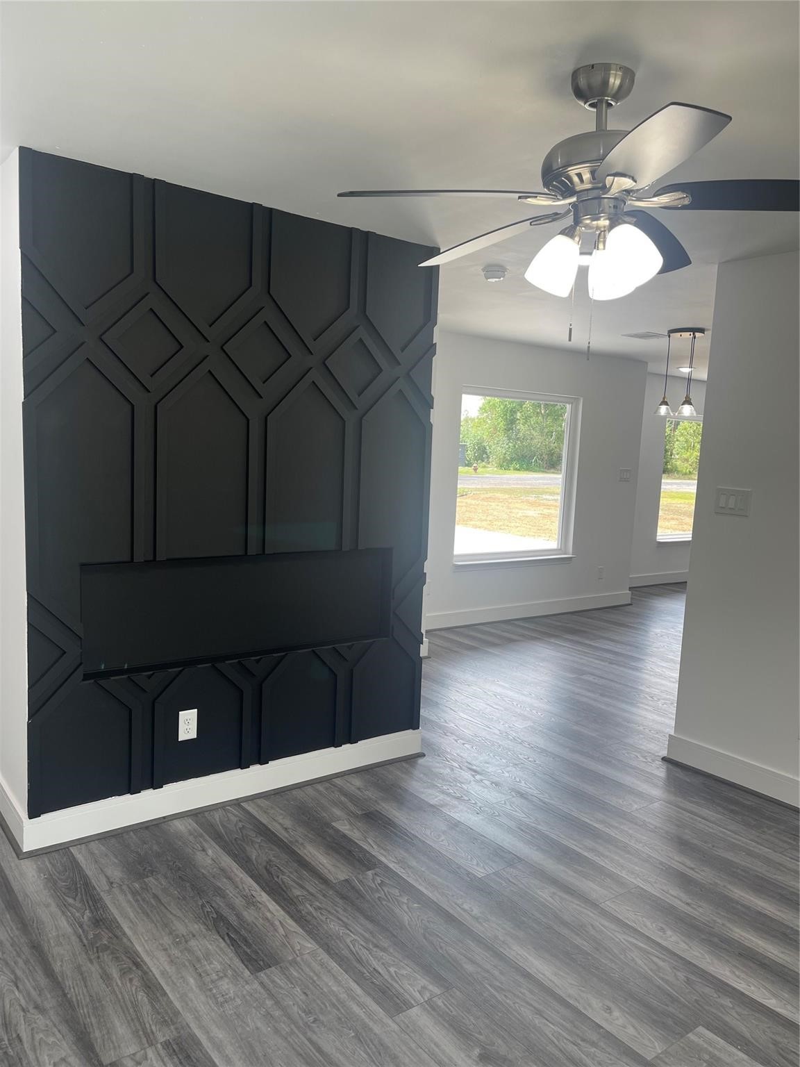 5821 Lantern Drive Beaumont, TX 77713 - Photo 15 of 17 an empty room with wooden floor and windows