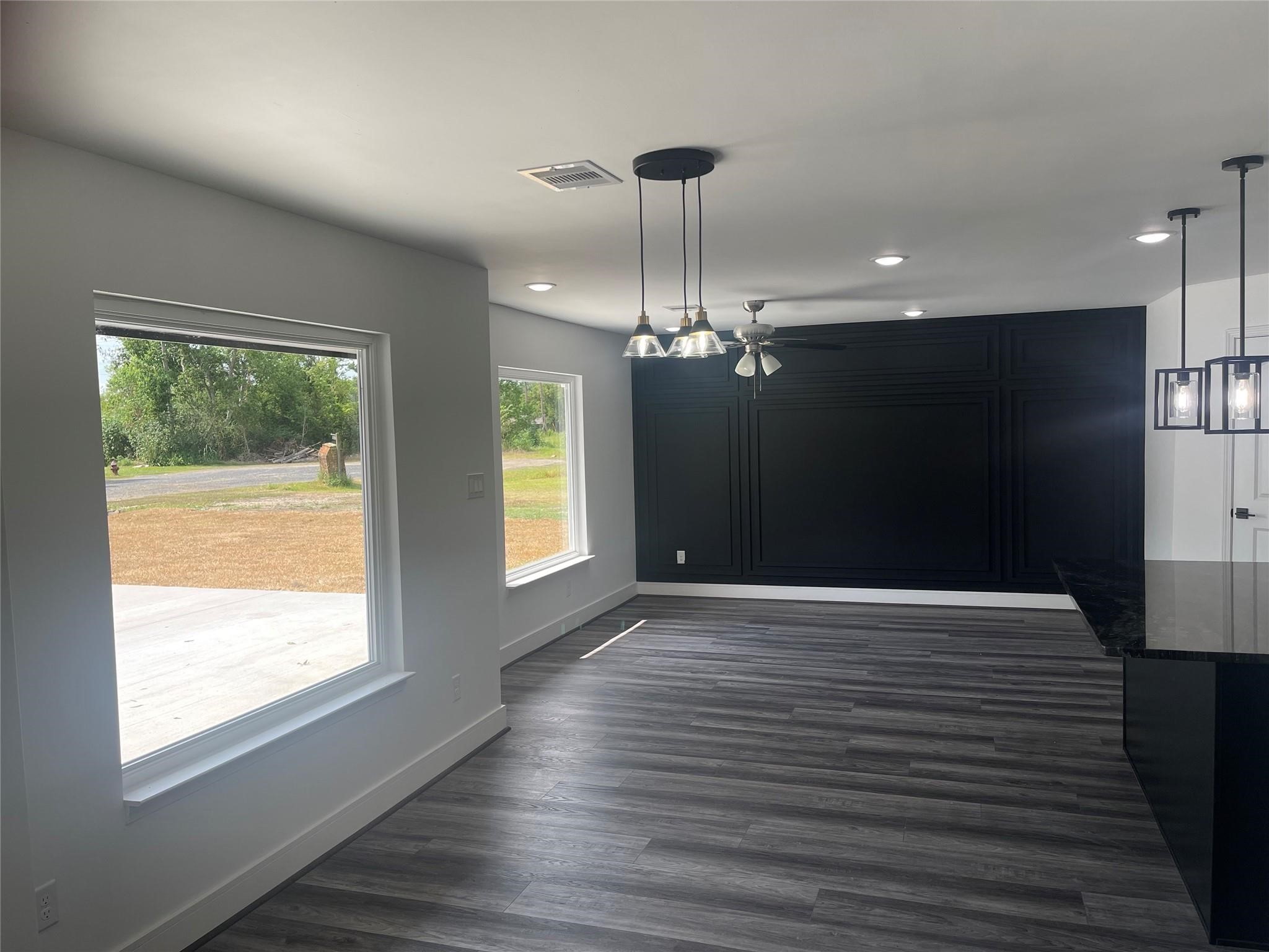 5821 Lantern Drive Beaumont, TX 77713 - Photo 2 of 17 a view of an empty room with wooden floor and a window