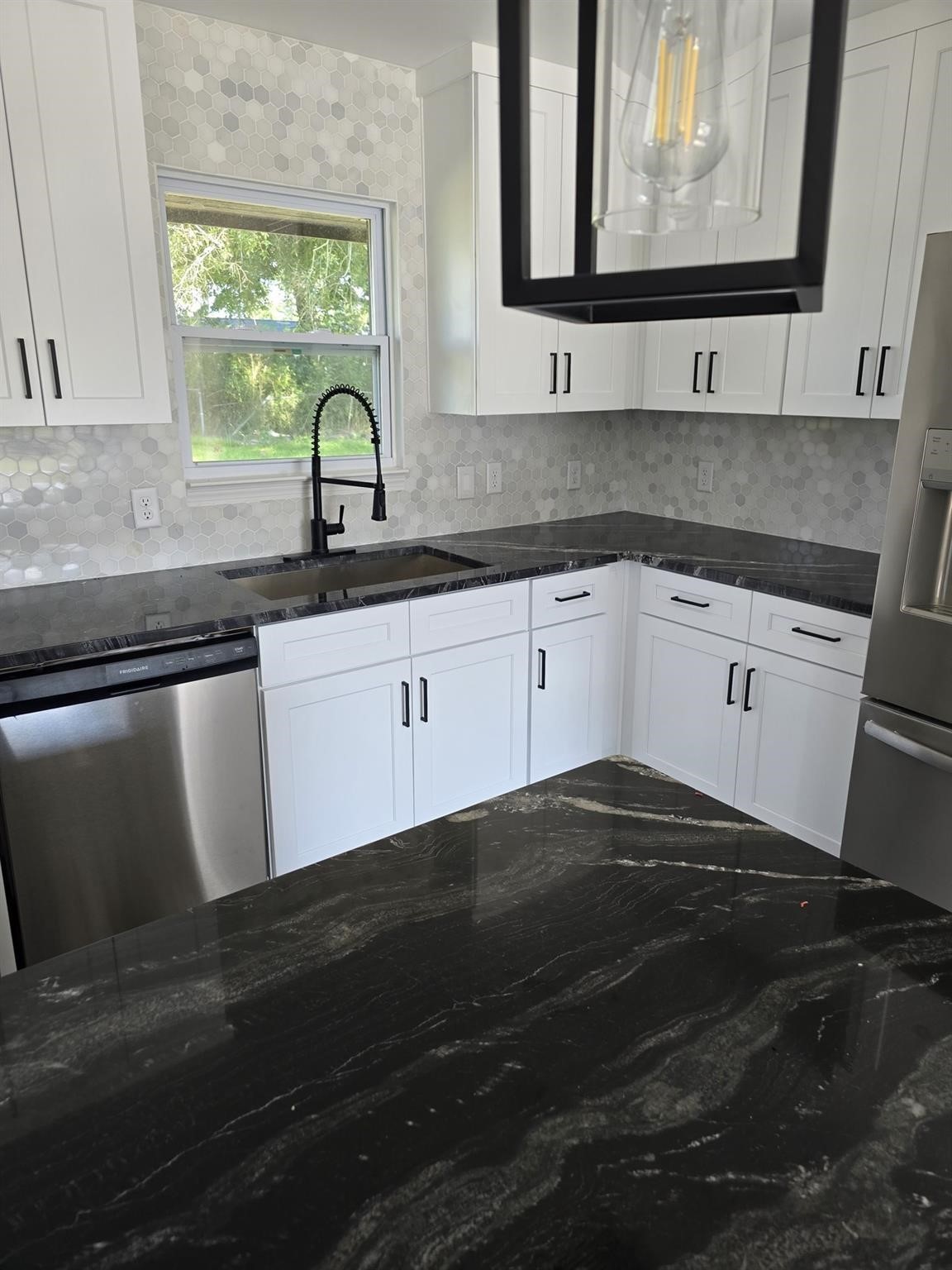 5821 Lantern Drive Beaumont, TX 77713 - Photo 10 of 17 a kitchen with a sink and a window