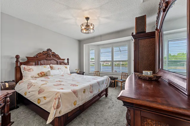 a bedroom with bed and window