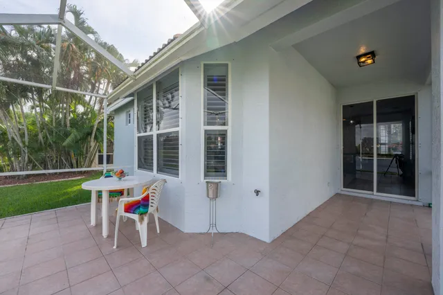 a view of house with backyard porch and garden
