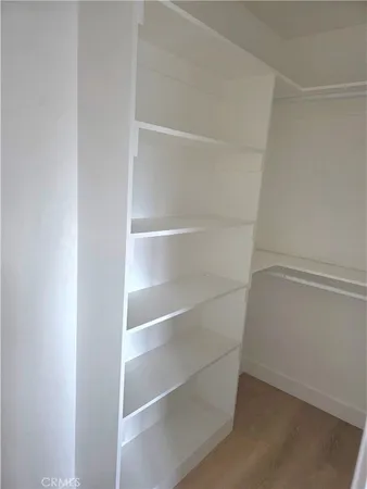 a view of an empty walk in closet