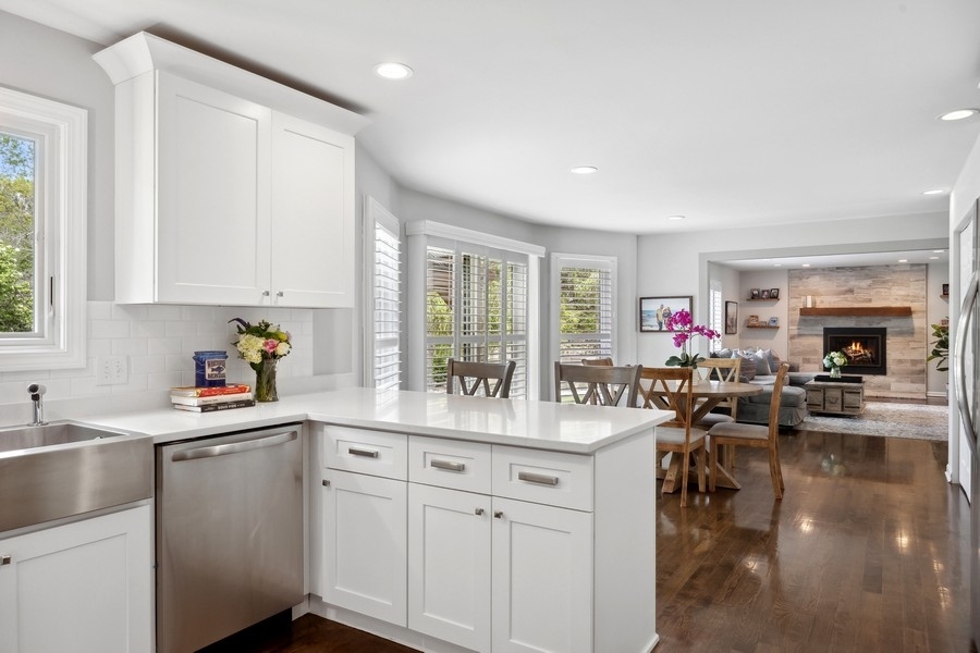 3900 Rugen Road Glenview, IL 60025 - Photo 15 of 44 a kitchen with a sink stove and cabinets