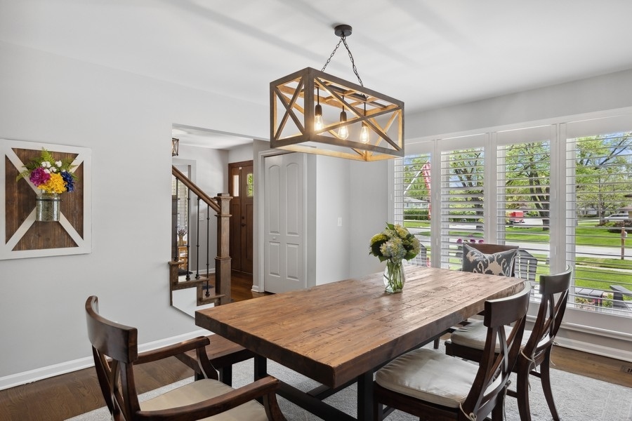 3900 Rugen Road Glenview, IL 60025 - Photo 18 of 44 a view of a dining room with furniture window and wooden floor