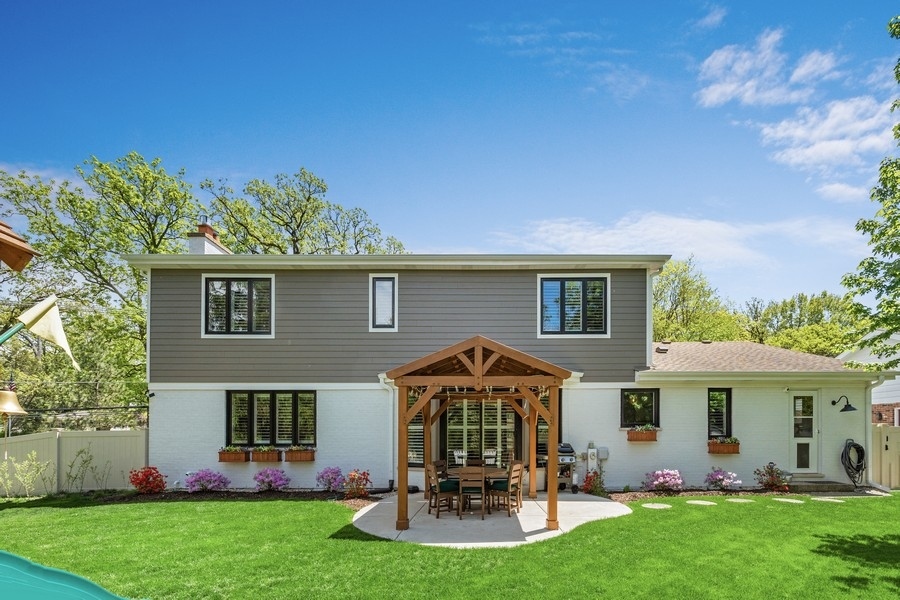 3900 Rugen Road Glenview, IL 60025 - Photo 35 of 44 front view of a house with a yard