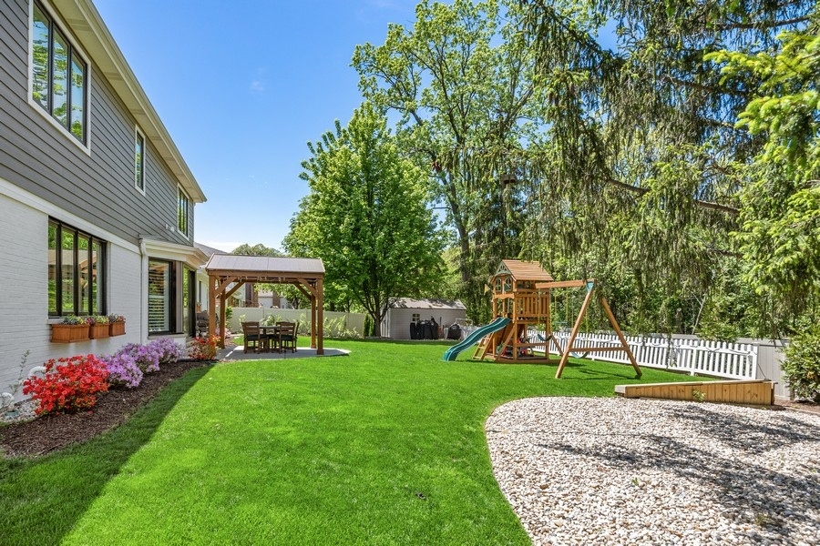 3900 Rugen Road Glenview, IL 60025 - Photo 38 of 44 a view of a house with a backyard