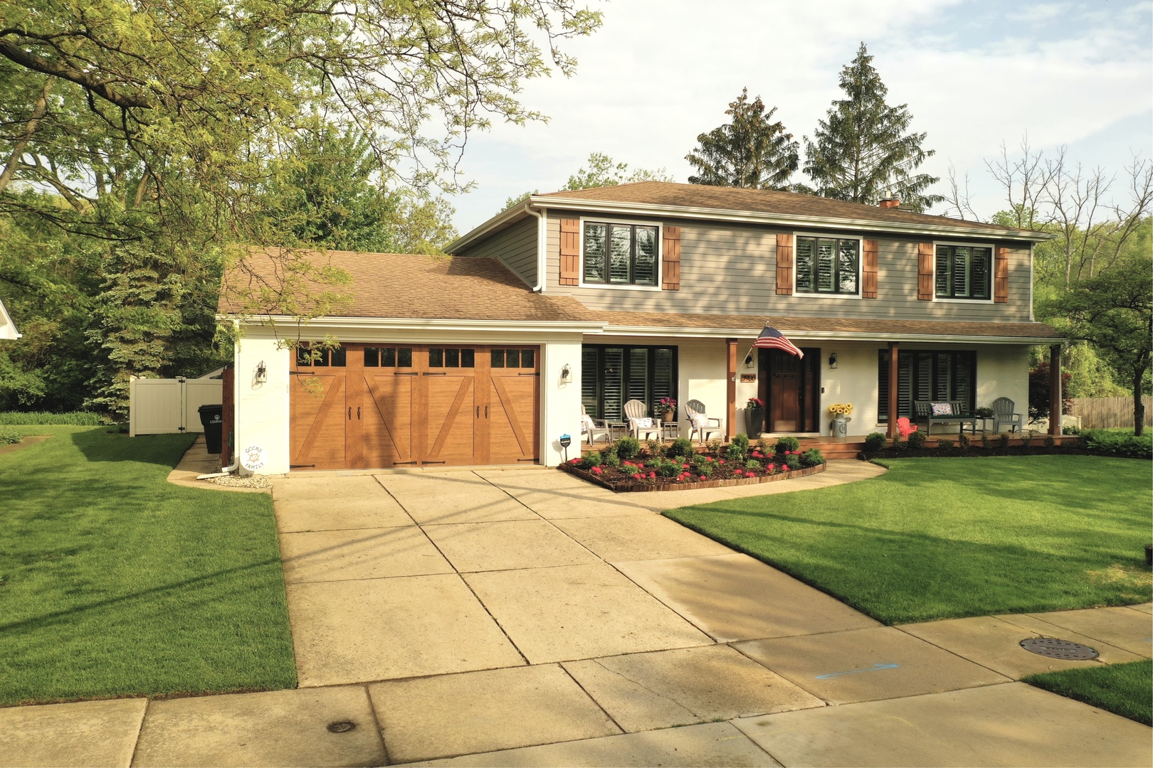3900 Rugen Road Glenview, IL 60025 - Photo 40 of 44 a front view of a house with swimming pool and garden