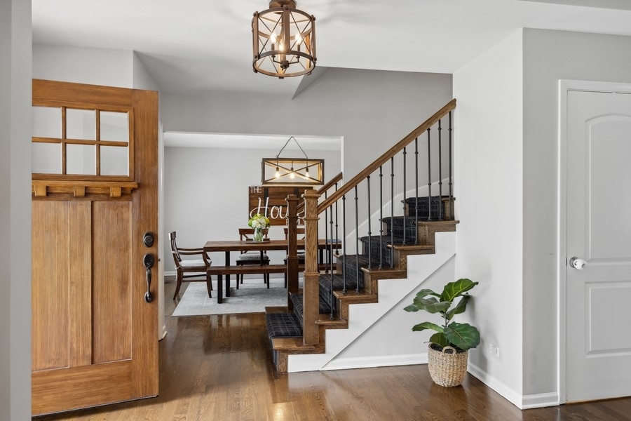 3900 Rugen Road Glenview, IL 60025 - Photo 4 of 44 a view of entryway and hall with wooden floor