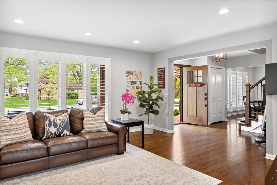 3900 Rugen Road Glenview, IL 60025 - Photo 5 of 44 a living room with furniture and a large window