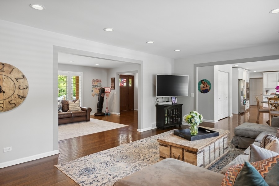 3900 Rugen Road Glenview, IL 60025 - Photo 6 of 44 a living room with furniture and a flat screen tv
