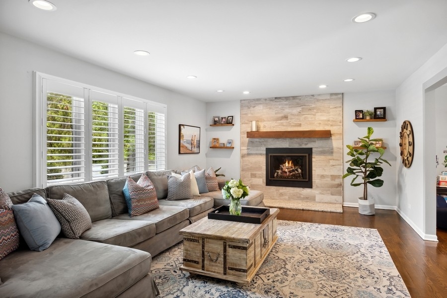 3900 Rugen Road Glenview, IL 60025 - Photo 8 of 44 a living room with furniture and a fireplace