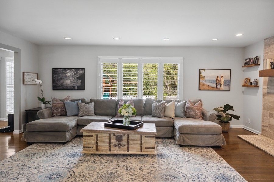 3900 Rugen Road Glenview, IL 60025 - Photo 9 of 44 a living room with furniture and a large window