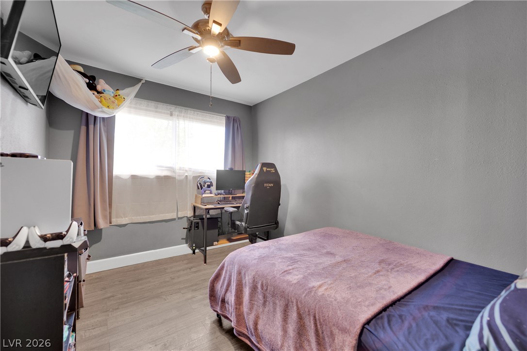 2221 Englestad Street North Las Vegas, NV 89030 - Photo 20 of 32 Functional bedroom featuring a window, and a ceiling fan for comfort.