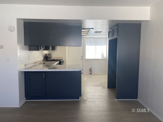 201 South Sunset Street Ridgecrest, CA 93555 - Photo 10 of 20 a bathroom with a sink and a mirror