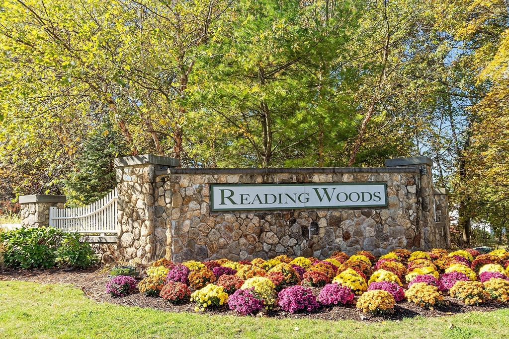 62 Abigail Way, Unit 3004 Reading, MA 01867 - Photo 2 of 37 a street sign that is sitting in the middle of a yard