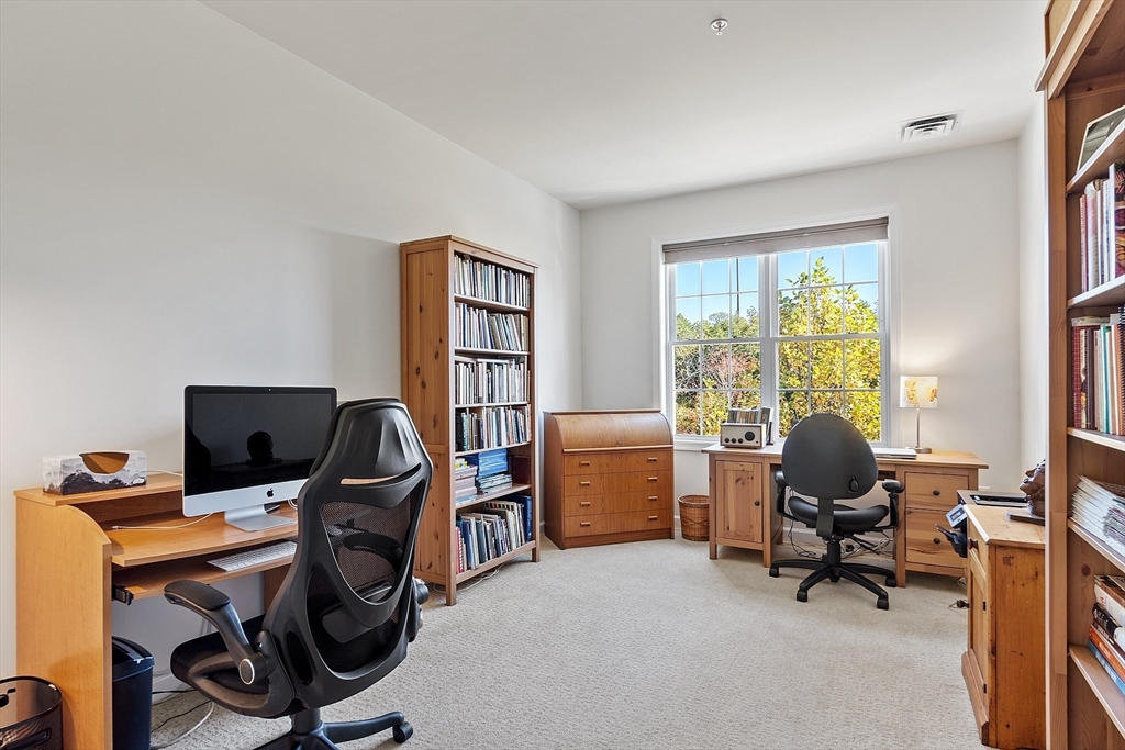 62 Abigail Way, Unit 3004 Reading, MA 01867 - Photo 23 of 37 a view of a workspace with furniture and a window