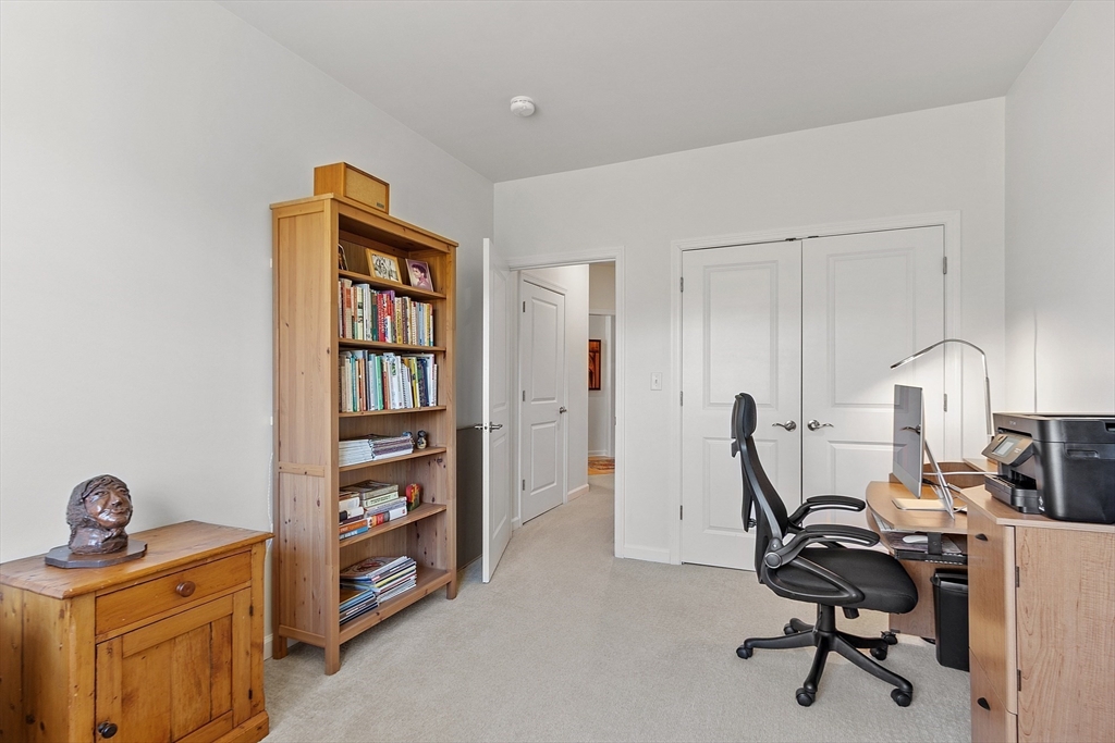 62 Abigail Way, Unit 3004 Reading, MA 01867 - Photo 24 of 37 a view of a workspace with furniture and a window