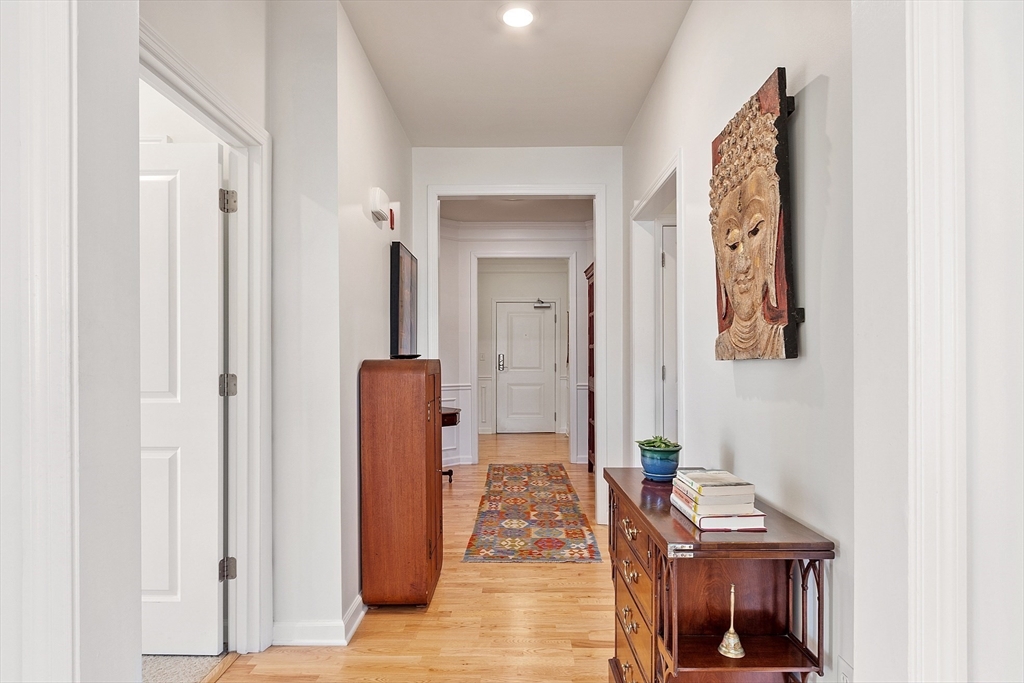 62 Abigail Way, Unit 3004 Reading, MA 01867 - Photo 28 of 37 hallway with furniture and wooden floor
