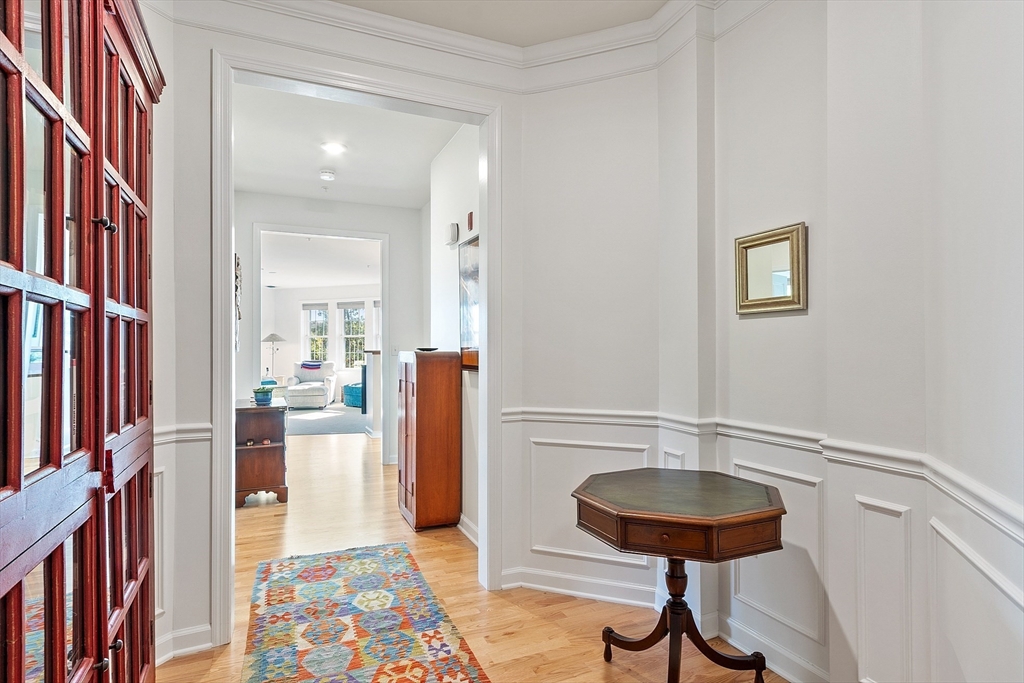 62 Abigail Way, Unit 3004 Reading, MA 01867 - Photo 29 of 37 a view of a room with furniture and wooden floor