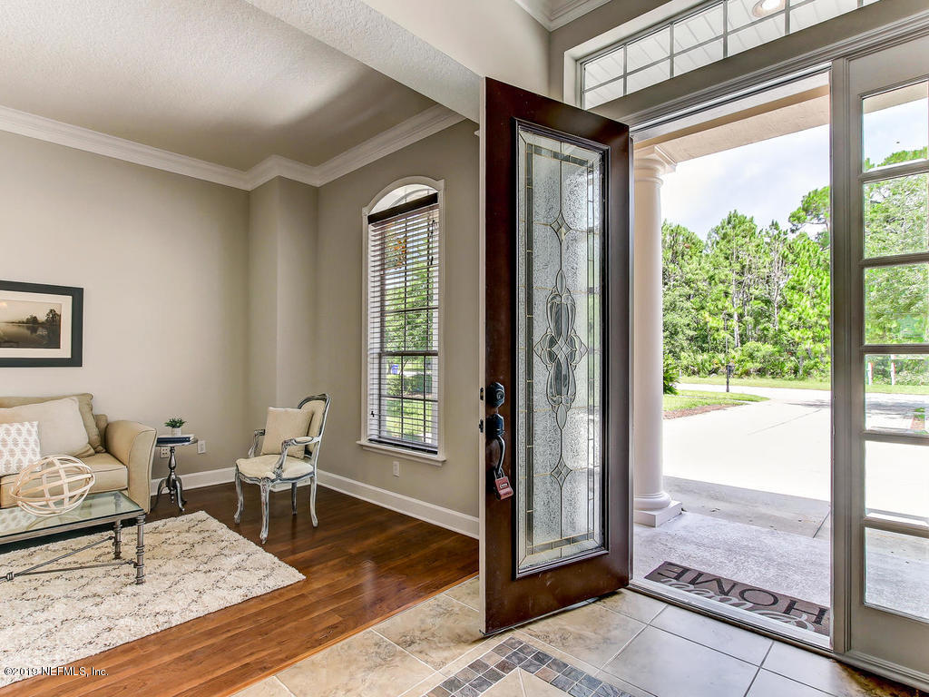 1780 North Loop Parkway St. Augustine, FL 32095 - Photo 11 of 98 a living room with furniture and a window