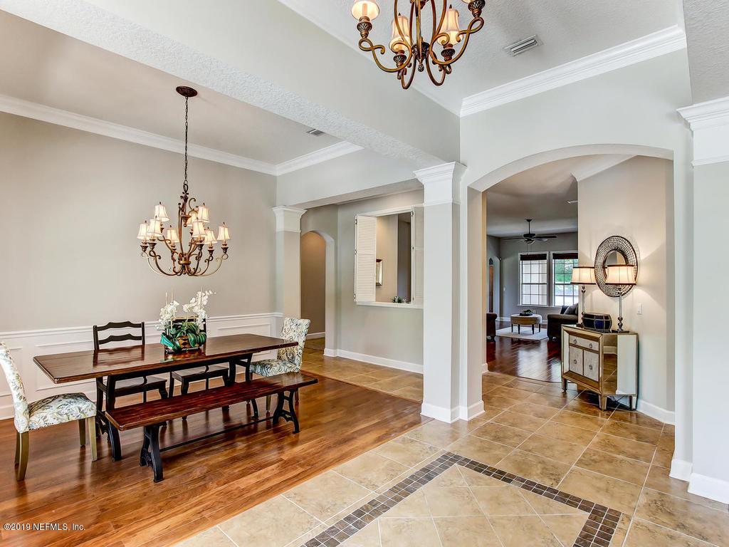 1780 North Loop Parkway St. Augustine, FL 32095 - Photo 13 of 98 a dining room with furniture a livingroom and chandelier