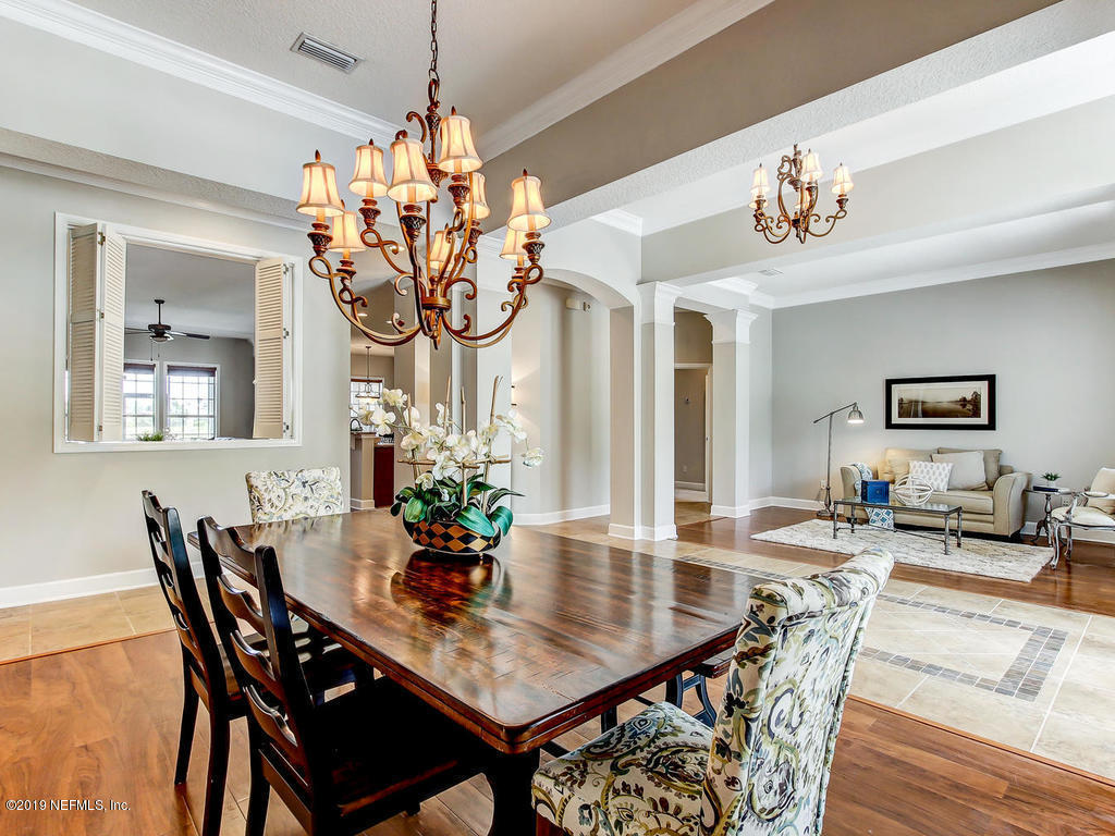 1780 North Loop Parkway St. Augustine, FL 32095 - Photo 14 of 98 a view of a dining room with furniture and chandelier