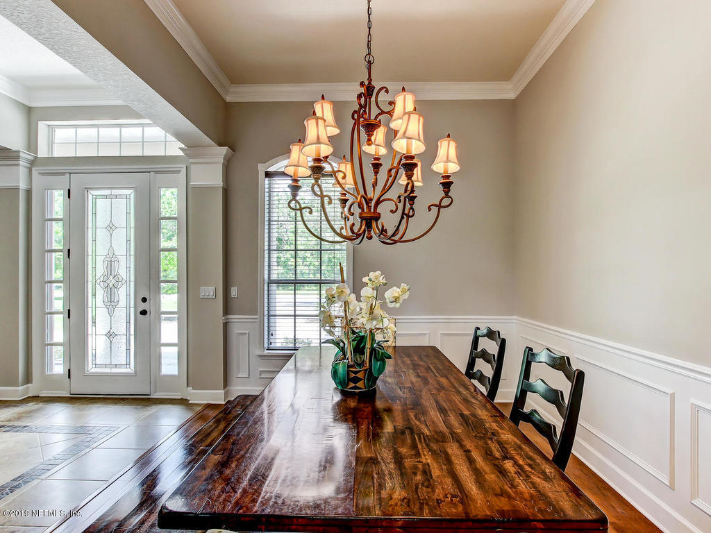 1780 North Loop Parkway St. Augustine, FL 32095 - Photo 15 of 98 a view of a dining room with furniture window and wooden floor