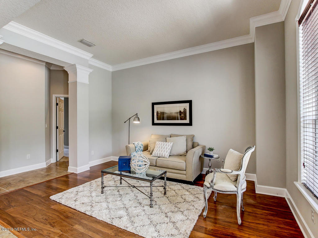 1780 North Loop Parkway St. Augustine, FL 32095 - Photo 16 of 98 a living room with furniture and a wooden floor