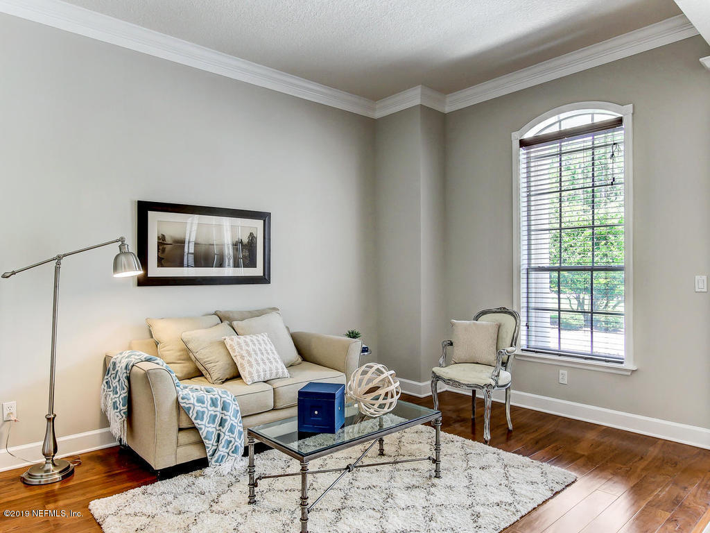 1780 North Loop Parkway St. Augustine, FL 32095 - Photo 17 of 98 a living room with furniture and wooden floor