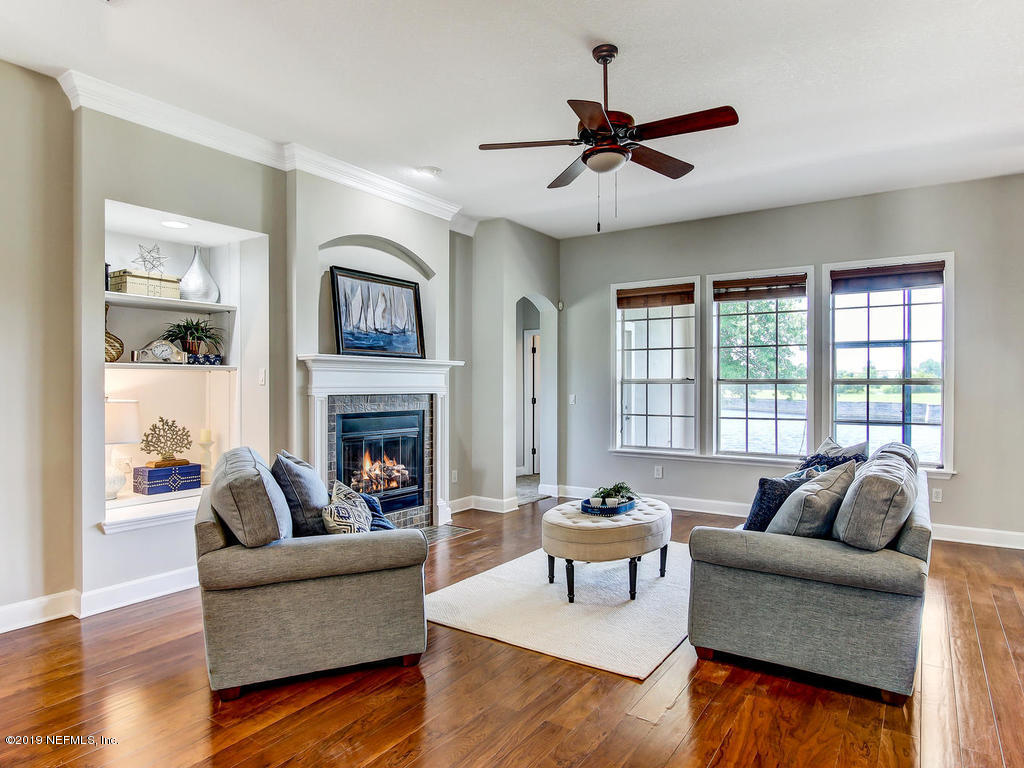 1780 North Loop Parkway St. Augustine, FL 32095 - Photo 2 of 98 a living room with furniture and a fireplace