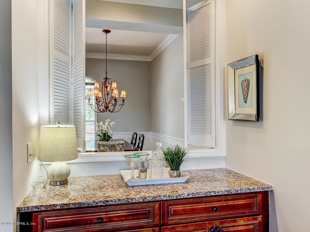 1780 North Loop Parkway St. Augustine, FL 32095 - Photo 25 of 98 a view of living room with granite countertop furniture and mirror
